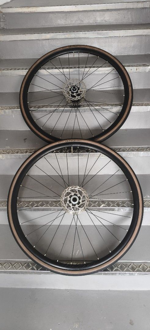 Merida Reacto Wheelset (Category: Parts & Accessories) located in Singapore. Submitted by parrotlover (Listing ID 1429077197, Image 1). Description: Condition 9.5/10 Loud Hub and Smooth Come With Rotor 140mm Continental 700x28c Tyre & Tube Using Less Than 150 km.
