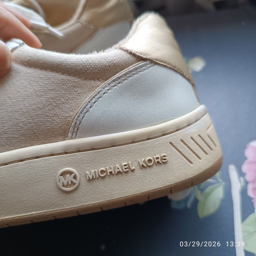 Michael Kors Sneakers (Category: Sneakers) located in Bacoor. Submitted by pamelott (Listing ID 1429034021, Image 2). Description: Brand: Michael Kors ​Style: Low-top fashion sneakers (court style) ​Colorway: Cream, white, and gold ​Materials: A multi-textured mix of smooth leather overlays, canvas or textile side panels, and metallic accents. Sold as is, pls. manage your exectations Flaws on ohotos.