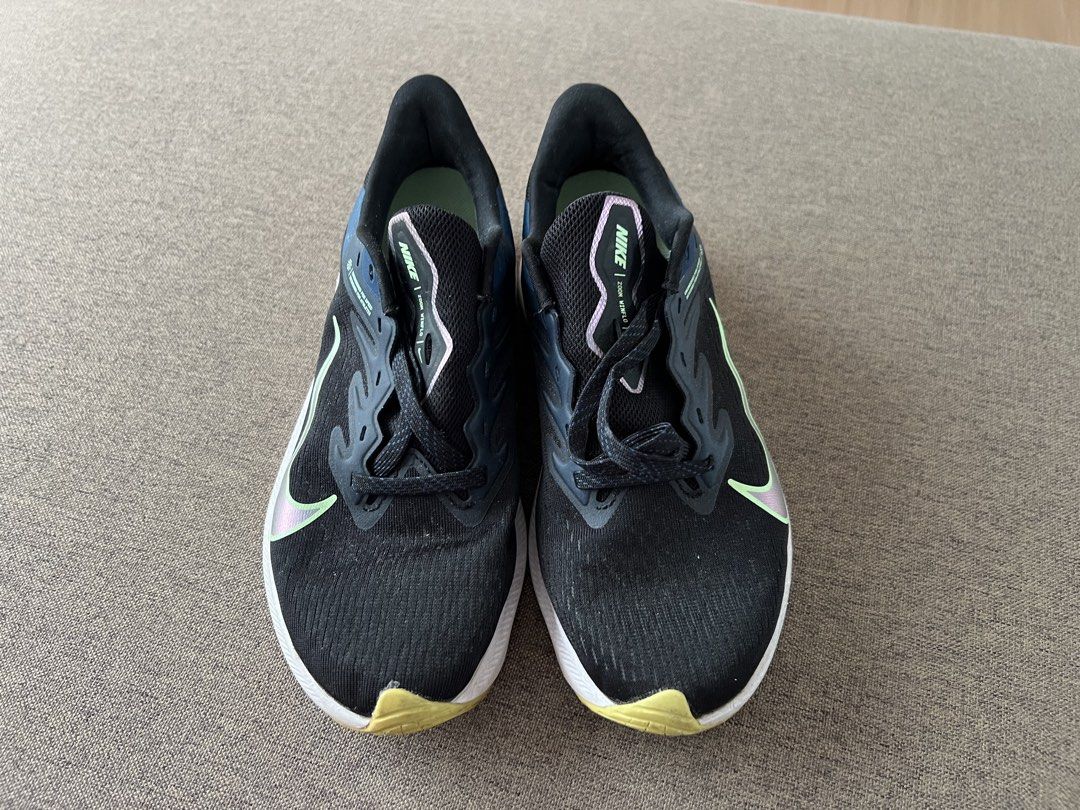 Nike Women Shoes (Category: Sneakers) located in Iloilo. Submitted by jfindsss2 (Listing ID 1428993364, Image 2). Description: 800 Each Pm for more info ALL AUTHENTIC These Nike running shoes feature a black and white design with the Nike swoosh logo. The images show two different models: Zoom Winflo and Quest. The Zoom Winflo model has a teal accent on the tongue and the Quest model has a pink accent. Both models have a white sole..