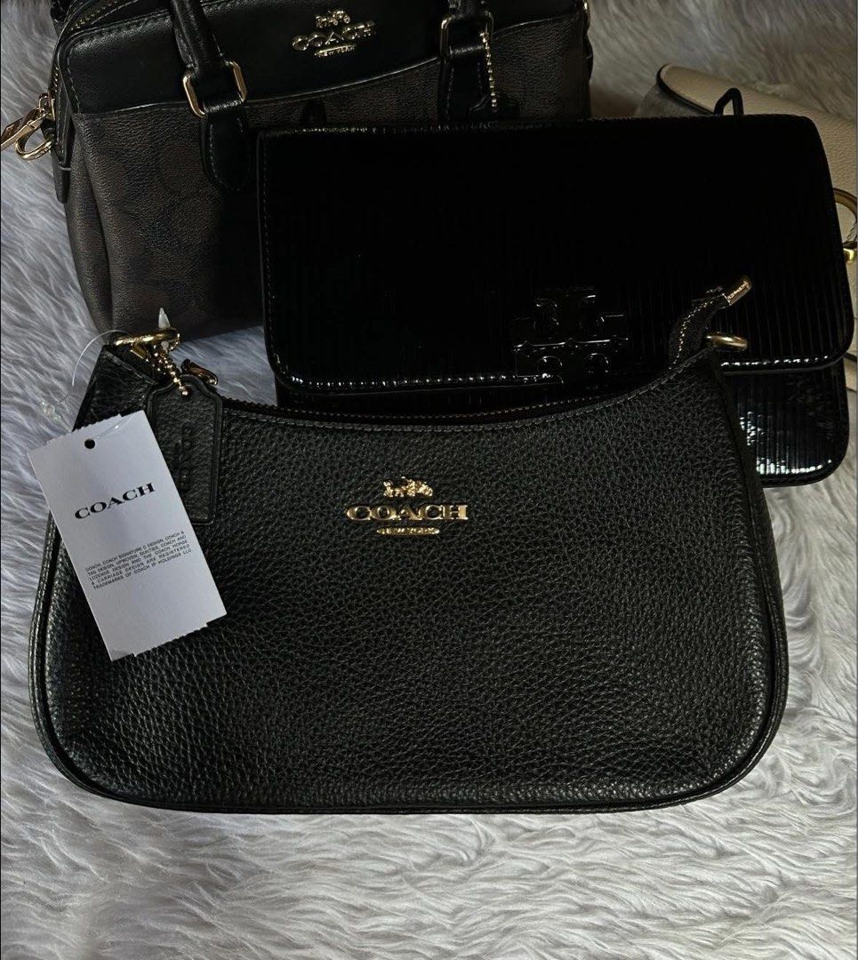 Original Coach Teri Black Leather Shoulder Bag (Category: Luxury Bags & Wallets) located in Quezon City. Submitted by ellastore (Listing ID 1429132121, Image 3). Description: 💯 Guaranteed Original Decided to keep the Black Emory over this kaya selling my Teri instead ✅ Brandnew Pebbled Leather (hindi prone to gasgas) Durable leather material - Original Coach Teri Shoulder Bag - Classic black leather - Features gold hardware - Versatile design: s