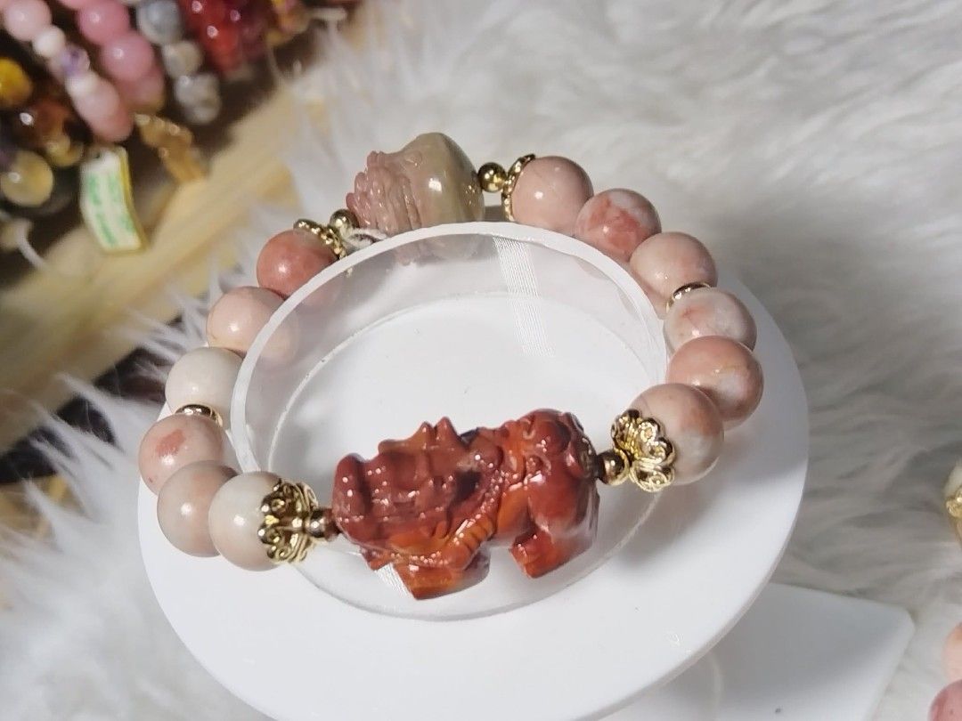 Pink Stone Bracelet with Pixiu Charm (Category: Bracelets) located in Quezon City. Submitted by ctraex (Listing ID 1429017229, Image 1). Description: Beautiful bracelet featuring pink stone beads and a carved Pixiu charm. The bracelet has gold-colored accents. The beads appear to be a mix of light and darker pink hues. This bracelet is a stylish accessory..