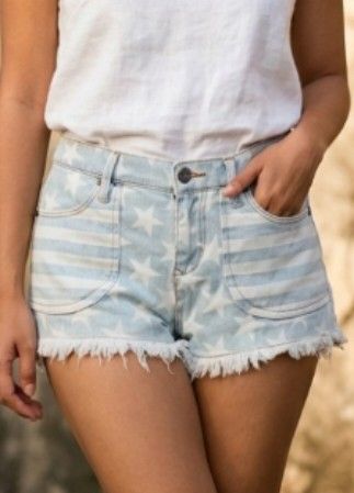Roxy Denim Shorts Size 27 (Category: Shorts) located in Bacoor. Submitted by pamelott (Listing ID 1428022142, Image 1). Description: ​Brand: Roxy Denim ​Size: S / 27 (Small, Waist size 27) ​Style: Low-to-mid rise cut-off denim shorts. ​Design & Pattern: * Americana Theme: Features a unique mix of white stars and vertical stripes over a light blue denim wash. ​Front Pockets: Large, rounded "patch-style" front pockets with a striped pattern that co