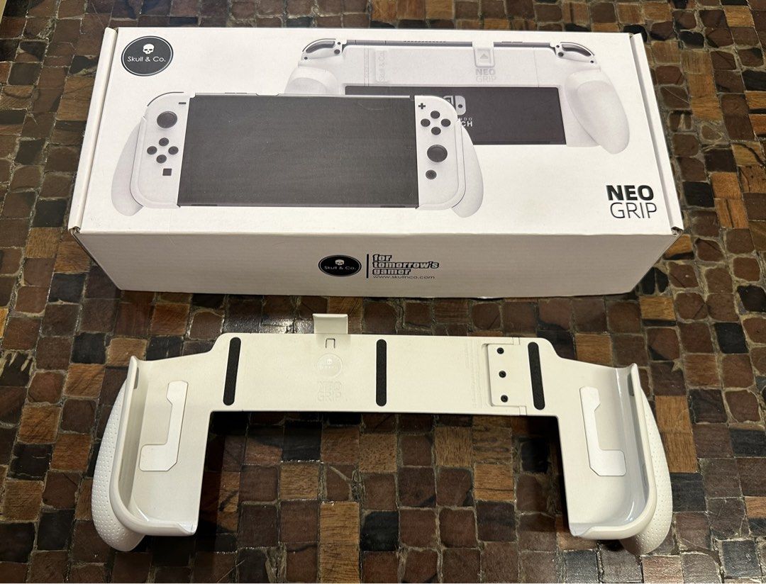 Skull & Co. NeoGrip for Nintendo Switch and OLED (Category: Other Mobile & Gadget Accessories) located in Mandaluyong City. Submitted by kjannah (Listing ID 1429002691, Image 1). Description: Skull & Co. NeoGrip for Nintendo Switch and Switch OLED White Nintendo Switch Case and Grip All attachments included (not used) Bought for 1,100 pesos in Data Blitz Tried the Plus Grip only once RFS: Immediatelty bought a new hand case.
