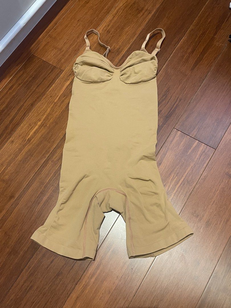 SOLA Shapewear Bodysuit - Size L (Category: Undergarments & Loungewear) located in Tacloban City. Submitted by declutterwithbel (Listing ID 1429047782, Image 1). Description: SOLA shapewear bodysuit in size L. Made of 84% nylon and 16% spandex. Features adjustable straps and a built-in bra. The color is a nude/beige tone. Machine washable, tumble dry low. Refer to the size guide for measurements. Provides shaping and support for a smooth silhouet