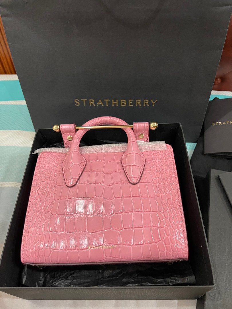 Strathberry Mini Tote Croc Embossed Pink (Category: Luxury Bags & Wallets) located in Subic. Submitted by ilovecmv (Listing ID 1429128279, Image 1). Description: Authentic Strathberry Mini Tote in a beautiful pink croc-embossed leather. Features a gold bar closure and top handle. Comes with the original box and dust bag. A stylish and compact bag perfect for everyday use or special occasions. The Strathberry logo is visible on the bag..