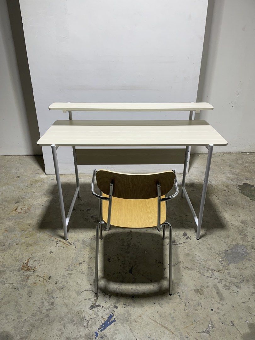 Study set (Category: Tables & Sets) located in Singapore. Submitted by oneseasons (Listing ID 1429129243, Image 1). Description: Study desk,MDF board with laminated finishing,dimensions,length 120cm,depth 55cm,height 75cm(big board),height 88cm,(small board);Study chair,metal frame with wooden seat and backrest,free delivery service. Available in 2 sets,2 sets price $110.