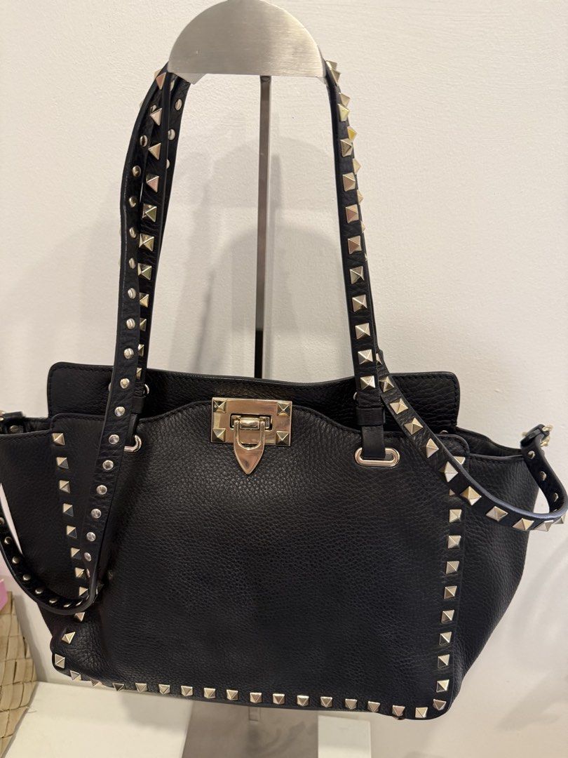 Valentino Garavani Rockstud Tote Bag (Category: Luxury Bags & Wallets) located in Pasay City. Submitted by wanabruce820 (Listing ID 1429054455, Image 2). Description: RFS: decluttering Complete Studs with Sling Provided dust bag only Bought in Osaka Japan Small size shoulder bag Black Preloved .