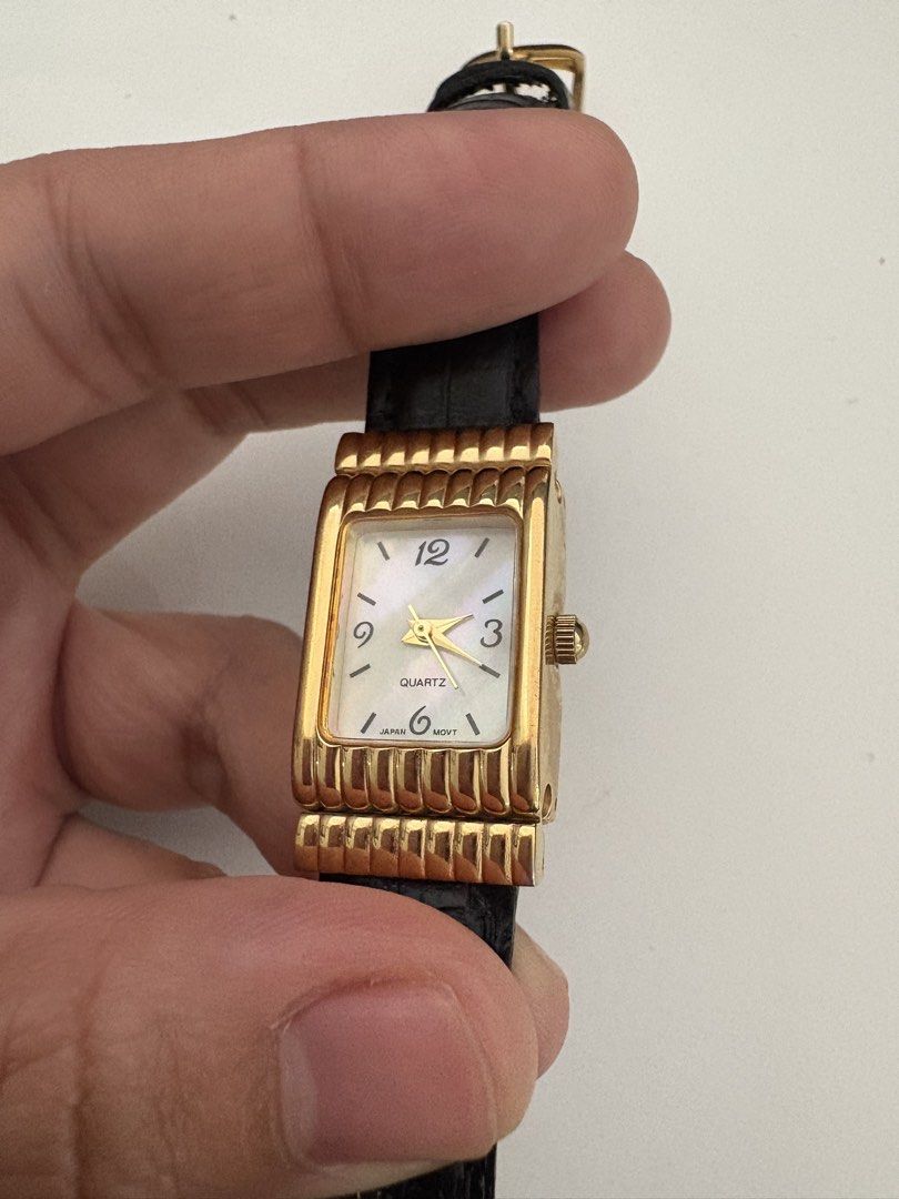 Vintage Avon Tank Watch (Category: Women's Watches) located in Murcia. Submitted by shansdecluttering (Listing ID 1429040475, Image 2). Description: Watch is fully functional with new batteries. Leather strap Mother of pearl face Quartz Japan Movement Watch bezel is in very good condition No scratches Thrifted in Japan.