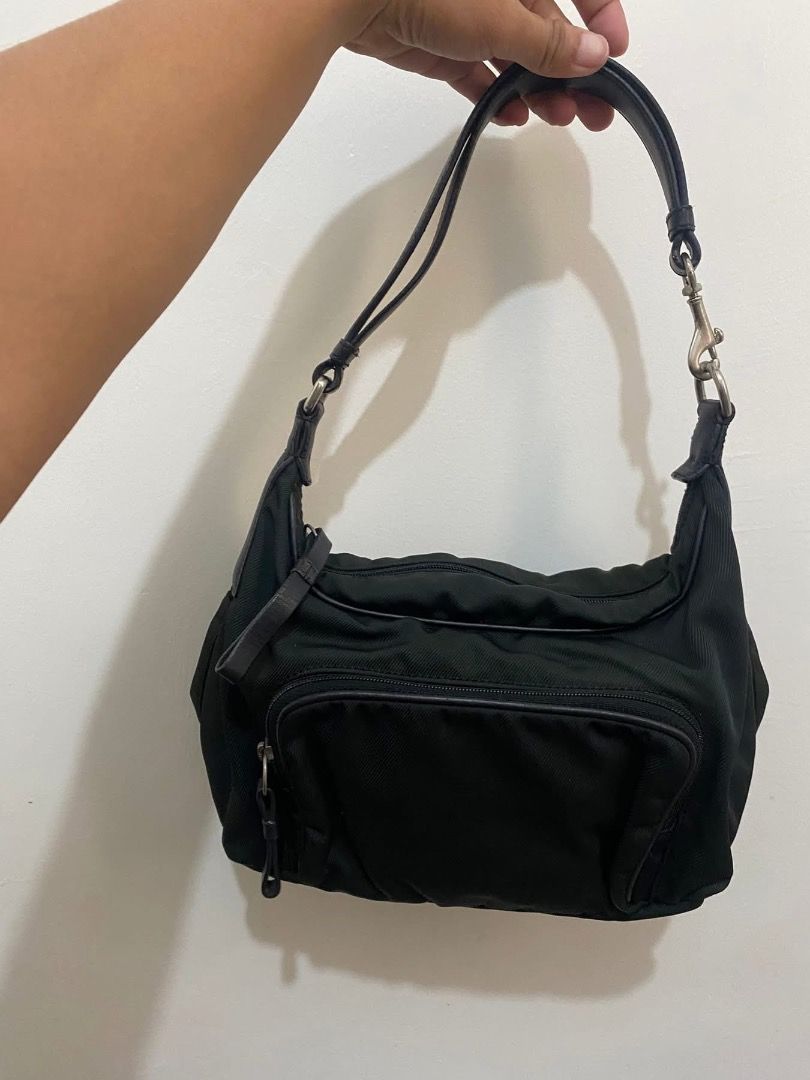 Vintage Coach Black Shoulder Bag nylon (Category: Luxury Bags & Wallets) located in Paete. Submitted by ladder_leynn (Listing ID 1429148743, Image 1). Description: Black shoulder bag with a front zippered pocket. Features a top handle and a detachable shoulder strap. The bag has a silver-tone hardware. The bag has a simple design, suitable for everyday use..