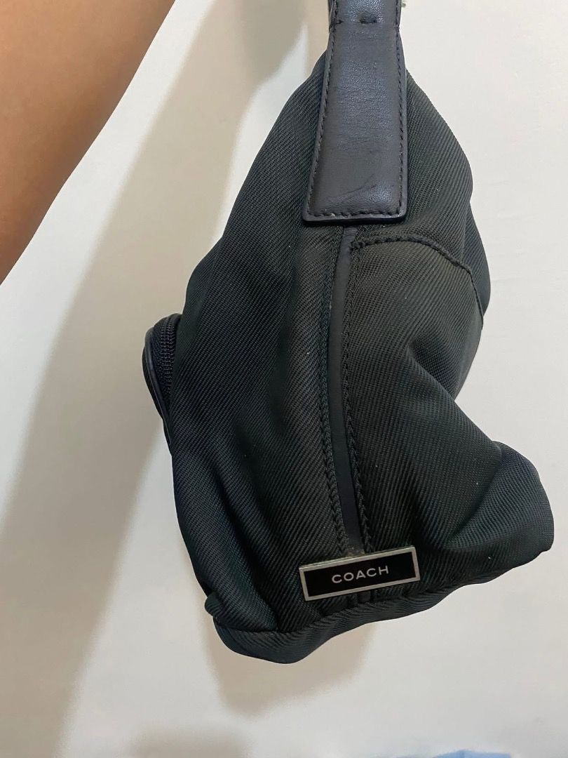 Vintage Coach Black Shoulder Bag nylon (Category: Luxury Bags & Wallets) located in Paete. Submitted by ladder_leynn (Listing ID 1429148743, Image 3). Description: Black shoulder bag with a front zippered pocket. Features a top handle and a detachable shoulder strap. The bag has a silver-tone hardware. The bag has a simple design, suitable for everyday use..