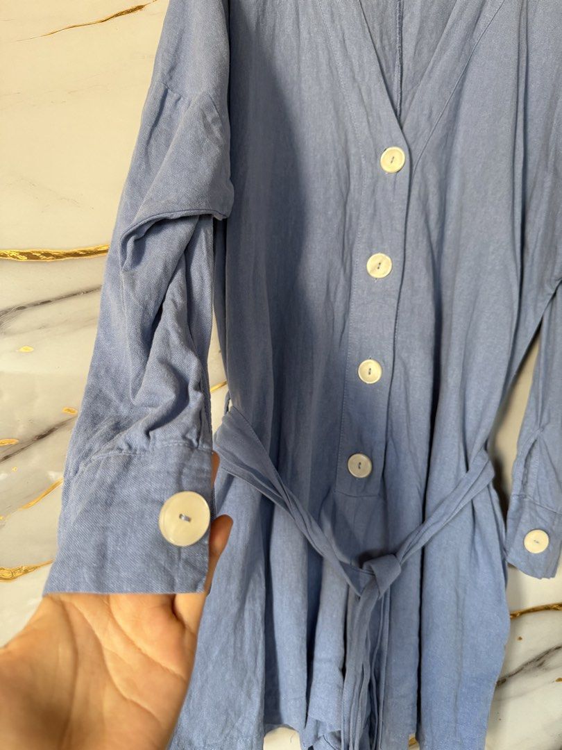ZARA Blue Romper with Belt (Category: Rompers) located in Marikina City. Submitted by declutter_keni24 (Listing ID 1429053198, Image 2). Description: Hey there! 👋 Check out this super cute ZARA blue romper! It's a size L, perfect for a comfy yet stylish look. This romper comes with a matching belt to cinch your waist and has a flattering V-neck design. 😉.