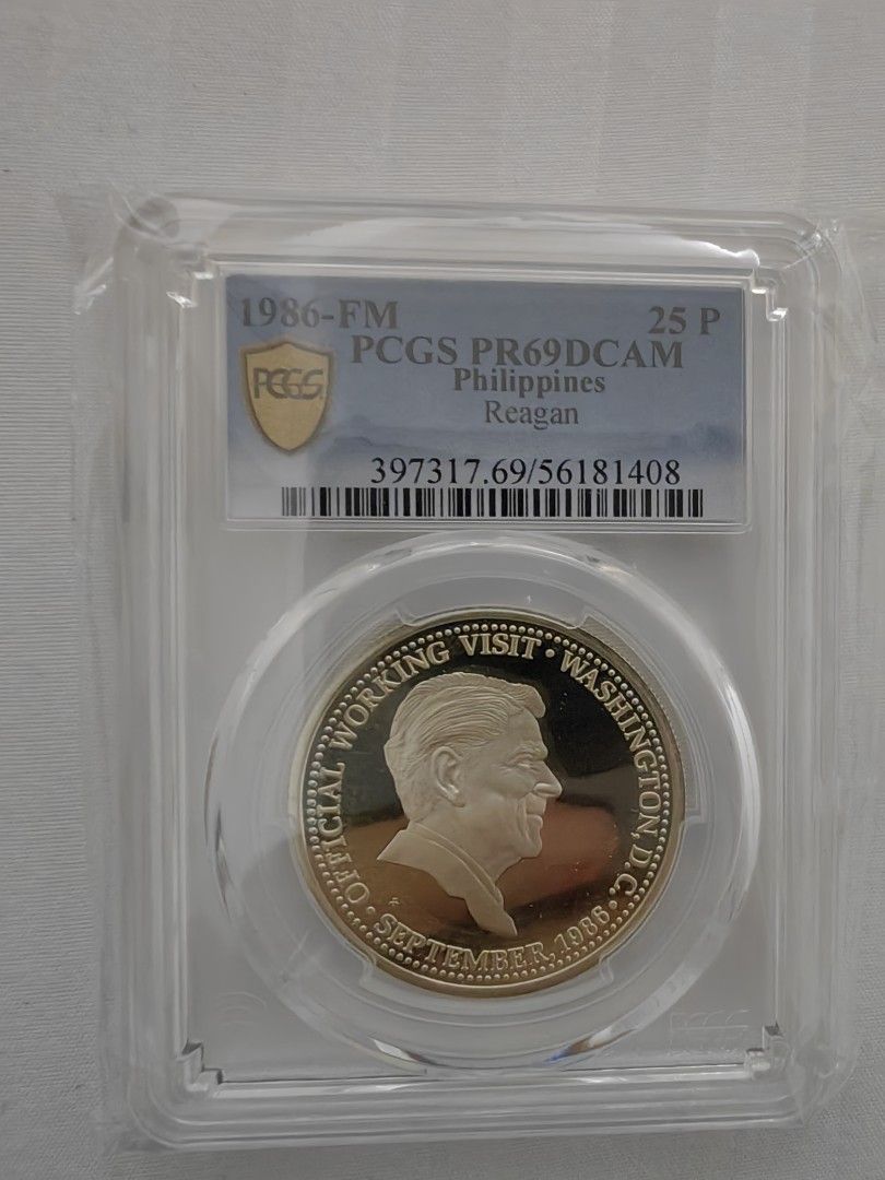 1986 Philippines Reagan Coin (Category: Currency) located in Davao. Submitted by ee2006 (Listing ID 1424438813, Image 1). Description: 1986 Philippines coin featuring Reagan. It is graded PCGS PR69DCAM. The coin commemorates the official working visit to Washington D.C. in September 1988. The coin is encased in a protective holder..