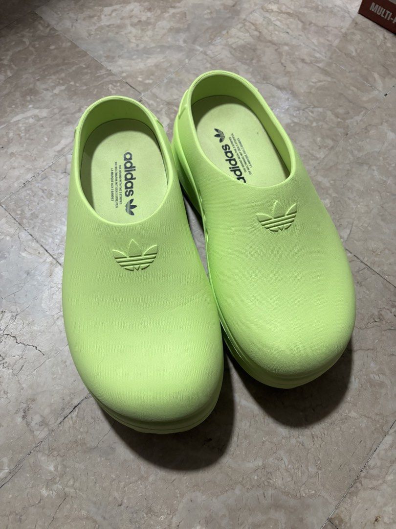 Adidas Adifom Stan Mule W - Green (Category: Sneakers) located in Bocaue. Submitted by lexaelleanac (Listing ID 1424365750, Image 3). Description: - Adidas Adifom Stan Mule W - Vibrant green color - Slip-on design - Adidas logo detail - US size 8, UK 7, EUR 40 2/3 - Model number: IE7050.