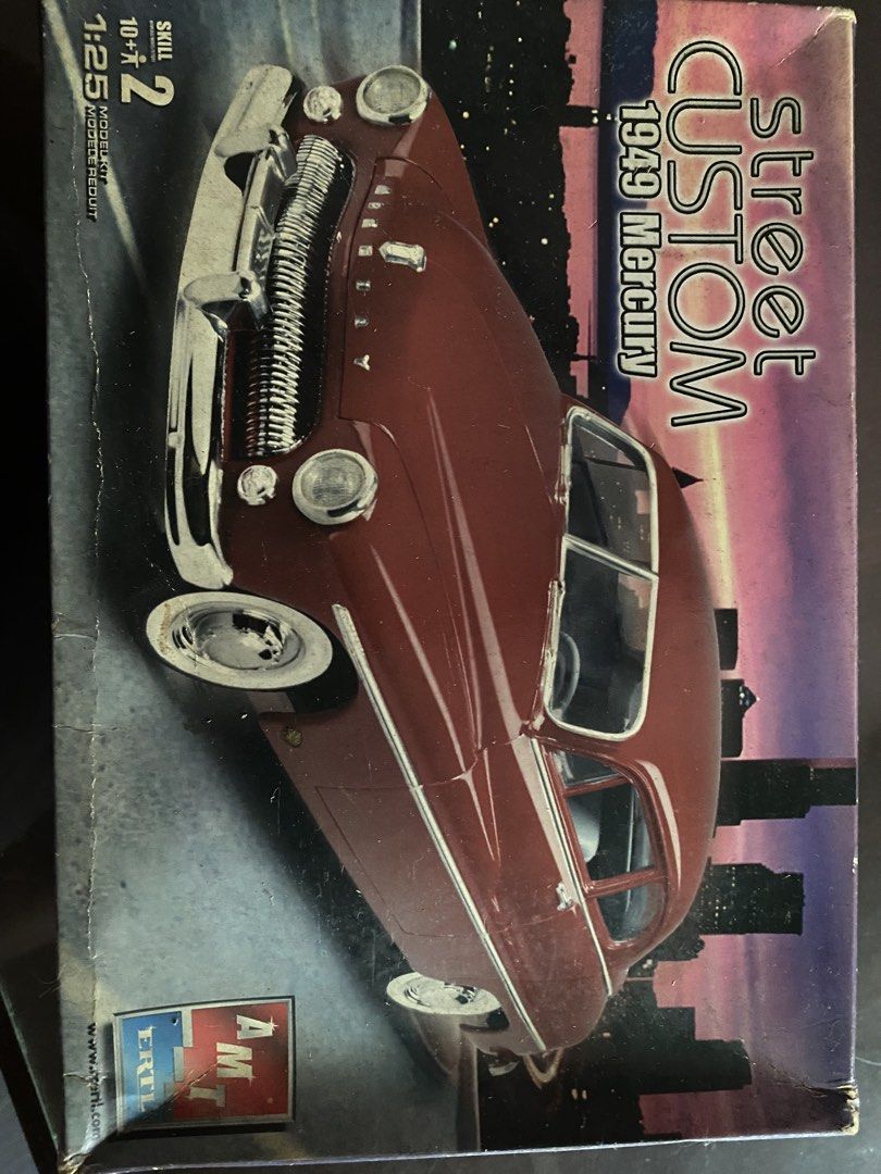 AMT 1949 Mercury Street Custom Model Kit (Category: Vehicle & Diecast Models) located in Pasig City. Submitted by ecochicsales (Listing ID 1424456900, Image 1). Description: 1:25 scale model kit of a 1949 Mercury Street Custom. The box shows the assembled car in a maroon color. The kit is marked as Skill Level 2. The parts appear to be sealed in plastic bags inside the box. The box has some wear and tear..