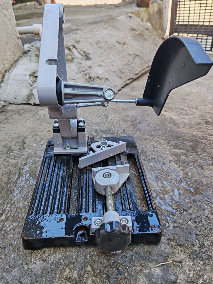 Angle Grinder and Drill Stand (Category: Construction Tools & Equipment) located in General Trias. Submitted by jeromebarb07856 (Listing ID 1424500346, Image 2). Description: Angle grinder and Drill stand with a black base and a gray support structure..