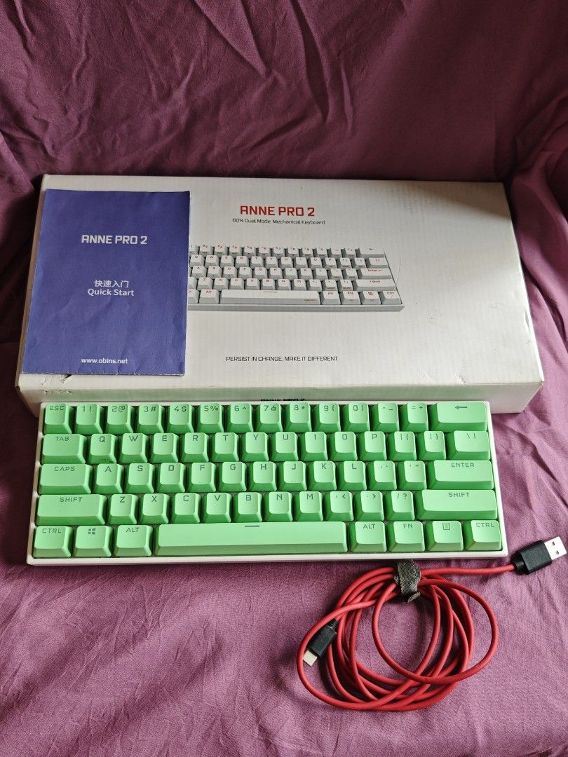 Anne Pro 2 60% Mechanical Keyboard (Category: Computer Keyboard) located in Quezon City. Submitted by farsiren06 (Listing ID 1424495174, Image 3). Description: - Anne Pro 2 60% mechanical keyboard - Green keycaps - White frame - Includes original box - Includes quick start guide - Includes red USB-C cable -With yellow stains sa gilid..