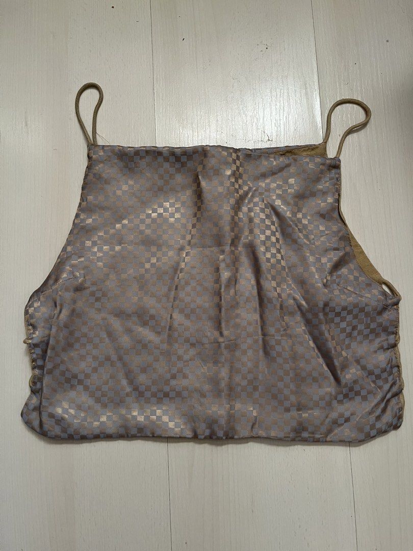 Araw Checkered Bintana Top (Category: Sleeveless) located in Makati City. Submitted by momentaryarchives (Listing ID 1424417758, Image 2). Description: - Unique checkered pattern - Neutral color palette - Thin straps - Reversible design (solid tan on the other side) - Side ties for adjustable fit - Brand tag visible Rfs: decluttering Can fit a S-M for a loose fit Design is archival .