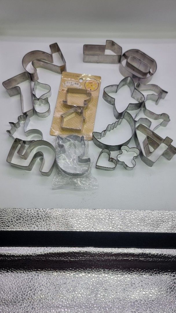 Assorted Cookie Cutter Set (Category: Bakeware) located in Marikina City. Submitted by andreah_16 (Listing ID 1424366047, Image 2). Description: Set includes various stainless steel cookie cutters in different shapes, including letters, numbers, and other fun designs. It also includes a set of cutters still in their original packaging. Perfect for baking cookies, pastries, or even crafting with playdough. Great for both beginners and experienced 