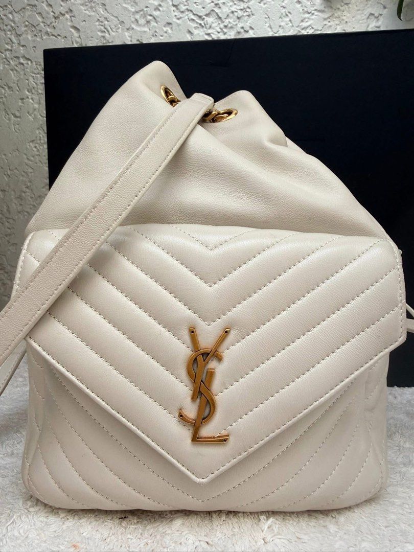 Authentic YSL Joe Drawstring Leather Backpack Bag Off White (Category: Luxury Bags & Wallets) located in Quezon City. Submitted by jhaediah (Listing ID 1366536164, Image 2). Description: Joe Drawstring Leather Backpack Bag Off White 💓3/3 Guaranteed Authentic Comes with Box,Dust bag,Cards and Receipt .