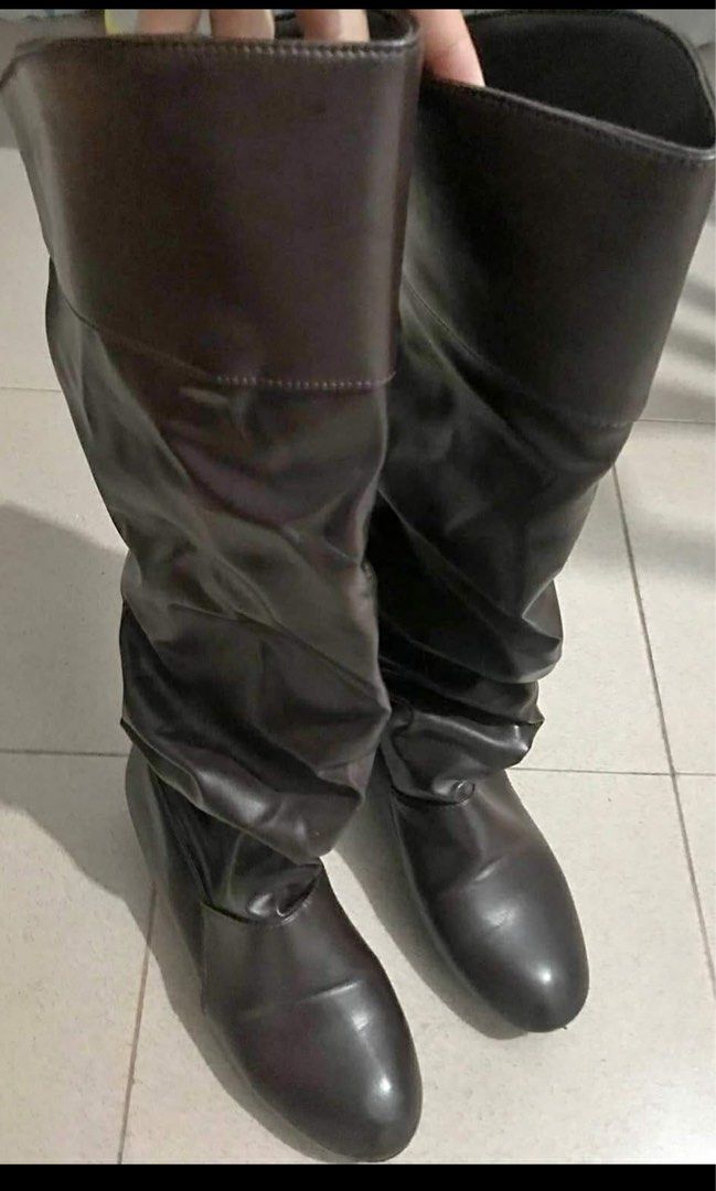 Brown Knee High Boots (Category: Boots) located in Pasay City. Submitted by nukachi (Listing ID 1424367827, Image 1). Description: - Brown knee-high boots - Slouchy design - Small heel - Leather-like material - Dark brown color - Suitable for casual wear.
