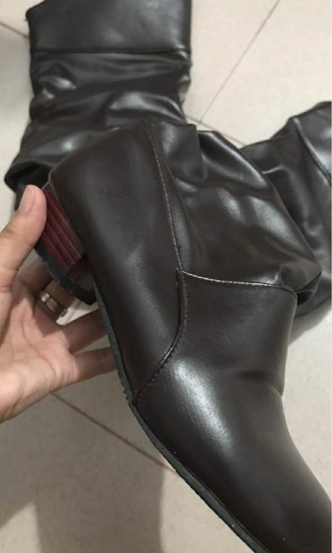 Brown Knee High Boots (Category: Boots) located in Pasay City. Submitted by nukachi (Listing ID 1424367827, Image 2). Description: - Brown knee-high boots - Slouchy design - Small heel - Leather-like material - Dark brown color - Suitable for casual wear.
