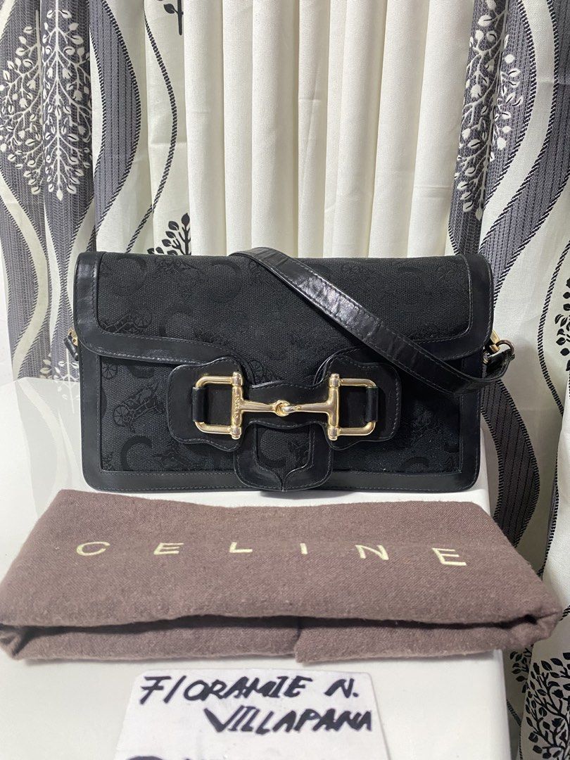 Celine Black Shoulder Bag (Category: Luxury Bags & Wallets) located in Tagum. Submitted by amarasluxbag (Listing ID 1424486033, Image 2). Description: - Authentic Celine shoulder bag - Black color - Gold-tone clasp - Patterned exterior - Multiple compartments Good condition normal sign ouf use Black na black pa in actual.