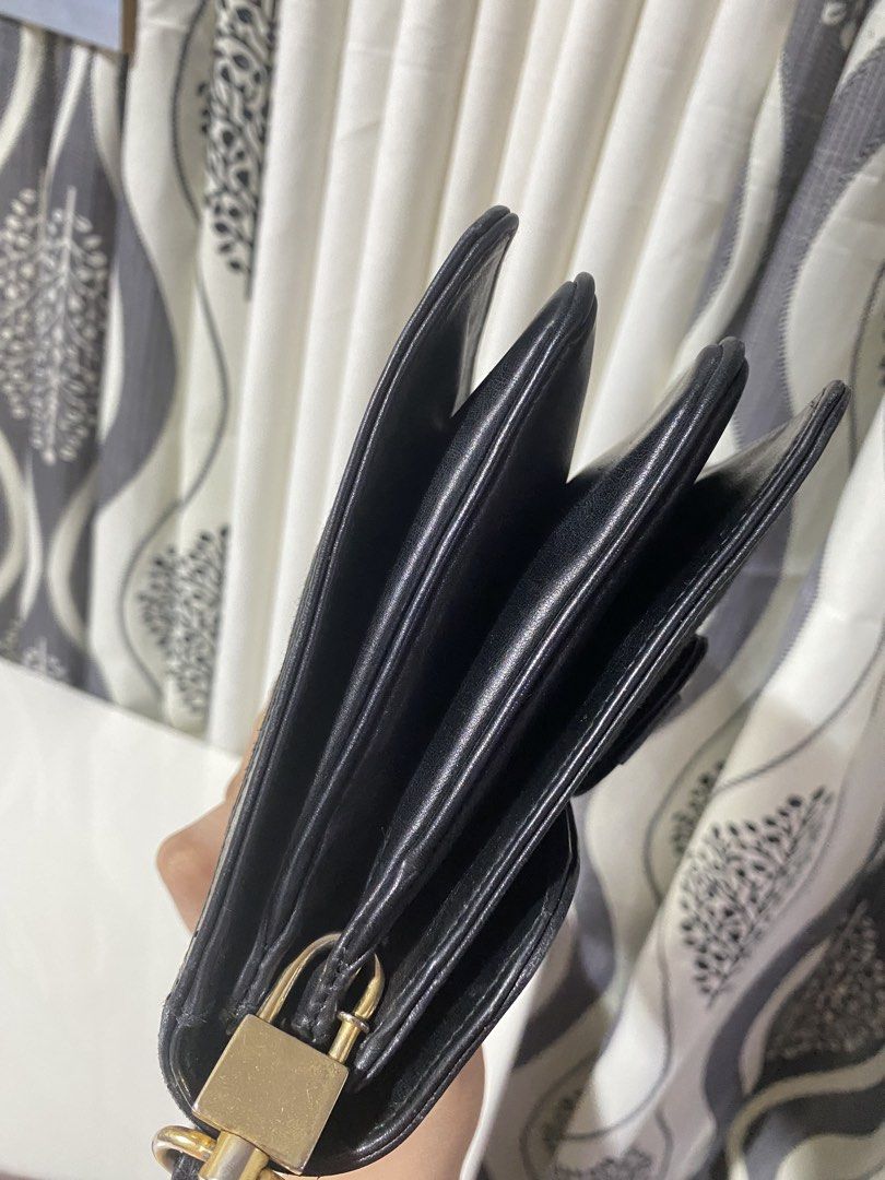 Celine Black Shoulder Bag (Category: Luxury Bags & Wallets) located in Tagum. Submitted by amarasluxbag (Listing ID 1424486033, Image 3). Description: - Authentic Celine shoulder bag - Black color - Gold-tone clasp - Patterned exterior - Multiple compartments Good condition normal sign ouf use Black na black pa in actual.