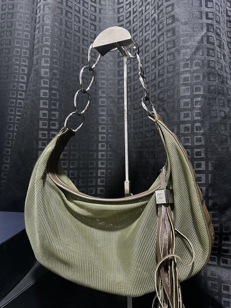 Chanel Hobo Bag with Chain Strap (Category: Luxury Bags & Wallets) located in Atok. Submitted by fullroom.dgs (Listing ID 1424450638, Image 1). Description: - Authentic Chanel hobo bag - Unique olive green mesh design - Brown leather trim - Stylish chain strap - Features a tassel detail - Chanel logo embossed on the side - Spacious interior - Comfortable shoulder strap.