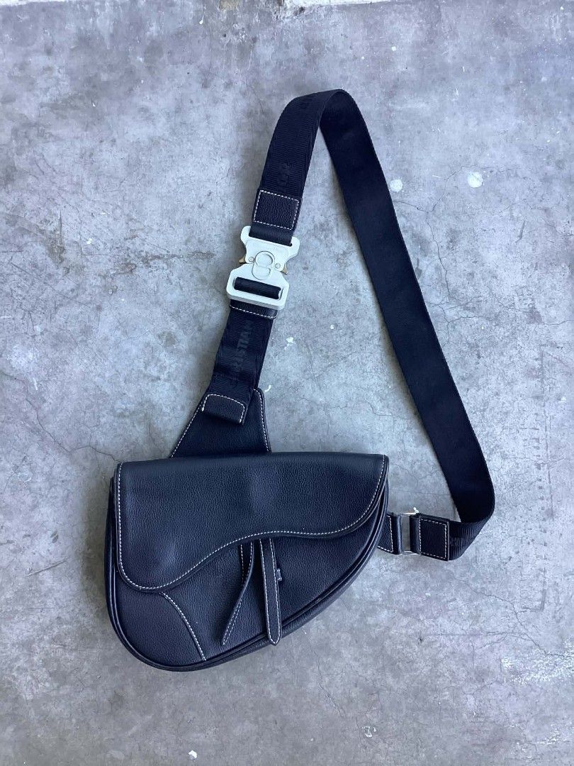 Christian Dior Saddle Sling Bag (Category: Luxury Bags & Wallets) located in Cavite. Submitted by benta_bounce (Listing ID 1424432136, Image 1). Description: - Christian Dior Saddle Sling Bag - Black leather exterior - White stitching detail - Silver-tone buckle - Christian Dior logo strap - Interior zipper closure - 'Made in Italy' label.