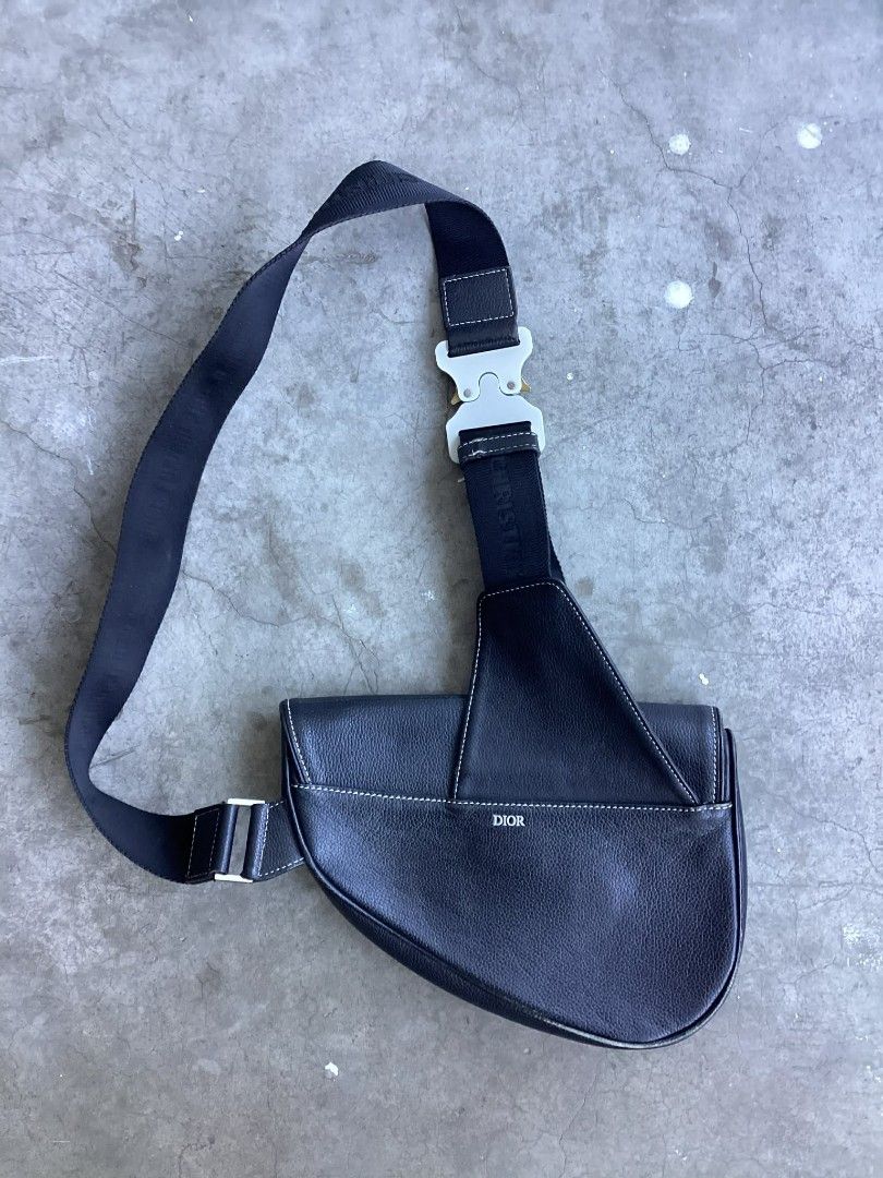 Christian Dior Saddle Sling Bag (Category: Luxury Bags & Wallets) located in Cavite. Submitted by benta_bounce (Listing ID 1424432136, Image 2). Description: - Christian Dior Saddle Sling Bag - Black leather exterior - White stitching detail - Silver-tone buckle - Christian Dior logo strap - Interior zipper closure - 'Made in Italy' label.