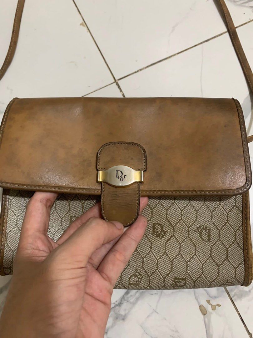 Christian Dior Shoulder Bag (Category: Luxury Bags & Wallets) located in Caloocan City. Submitted by pumarenluc79160 (Listing ID 1424352851, Image 3). Description: - Vintage Christian Dior shoulder bag - Features a brown leather flap and strap - Beige monogram pattern - Interior pocket - Made in France - Magnetic snap closure.