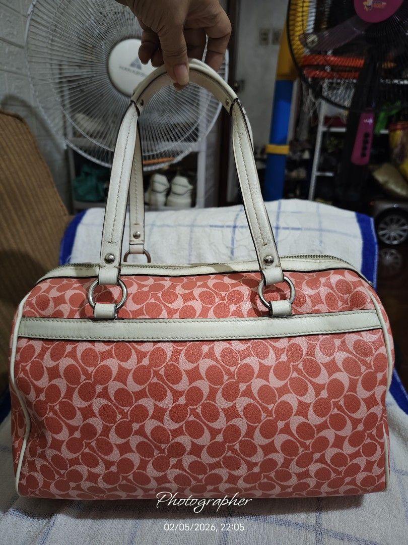 Coach Signature Satchel Handbag (Category: Luxury Bags & Wallets) located in Bulacan. Submitted by dstore4u (Listing ID 1424483065, Image 2). Description: - Authentic Coach handbag - Signature red and white pattern - Dual top handles - Secure zip closure - Central red stripe with Coach logo detail - Light pink fabric lining - Boston bag Second hand, with sign of use manage you expectations .