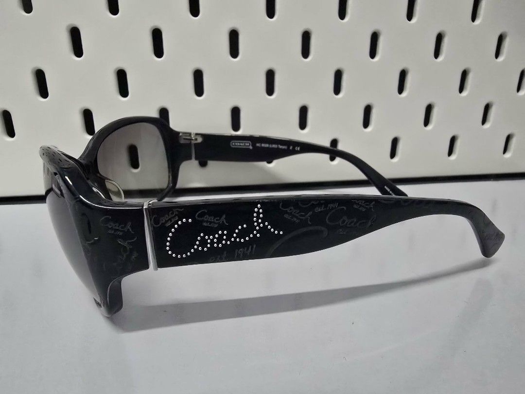 Coach Sunglasses HC 8028 (Category: Sunglasses & Eyewear) located in Manila. Submitted by ivyfcb (Listing ID 1424408695, Image 1). Description: Authentic Coach sunglasses. Features a black frame with the Coach logo on the temples. Includes the original case and cleaning cloth. The model number is HC 8028 (L903 Taryn). The lens size is 59mm, with a bridge size of 15mm and temple length of 125mm. The frame color is black..