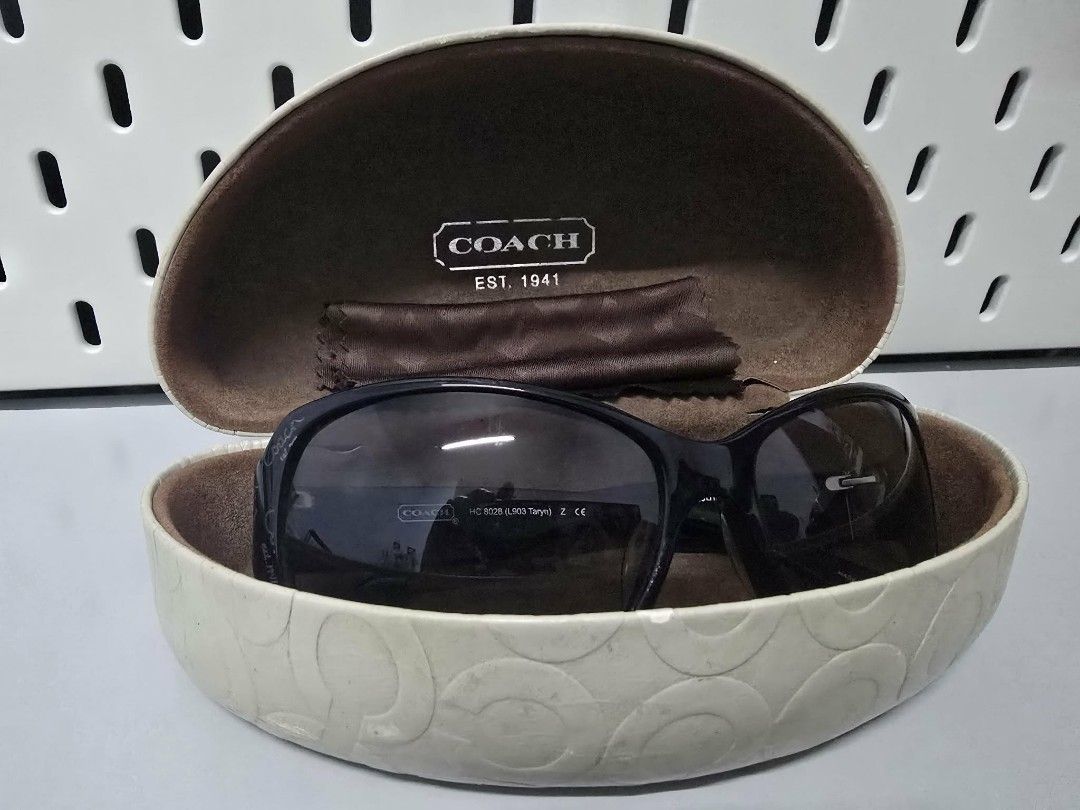 Coach Sunglasses HC 8028 (Category: Sunglasses & Eyewear) located in Manila. Submitted by ivyfcb (Listing ID 1424408695, Image 3). Description: Authentic Coach sunglasses. Features a black frame with the Coach logo on the temples. Includes the original case and cleaning cloth. The model number is HC 8028 (L903 Taryn). The lens size is 59mm, with a bridge size of 15mm and temple length of 125mm. The frame color is black..