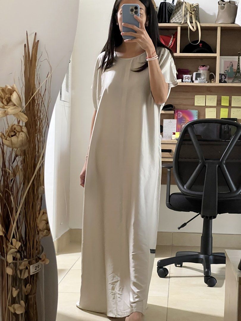 Cream-colored Kaftan (Category: Dresses) located in Santa Cruz. Submitted by beautsbees (Listing ID 1424482105, Image 2). Description: - Cream-colored maxi dress - Round neckline - Short sleeves - Loose, flowing silhouette - Lightweight fabric - Floor-length - Simple, minimalist design.
