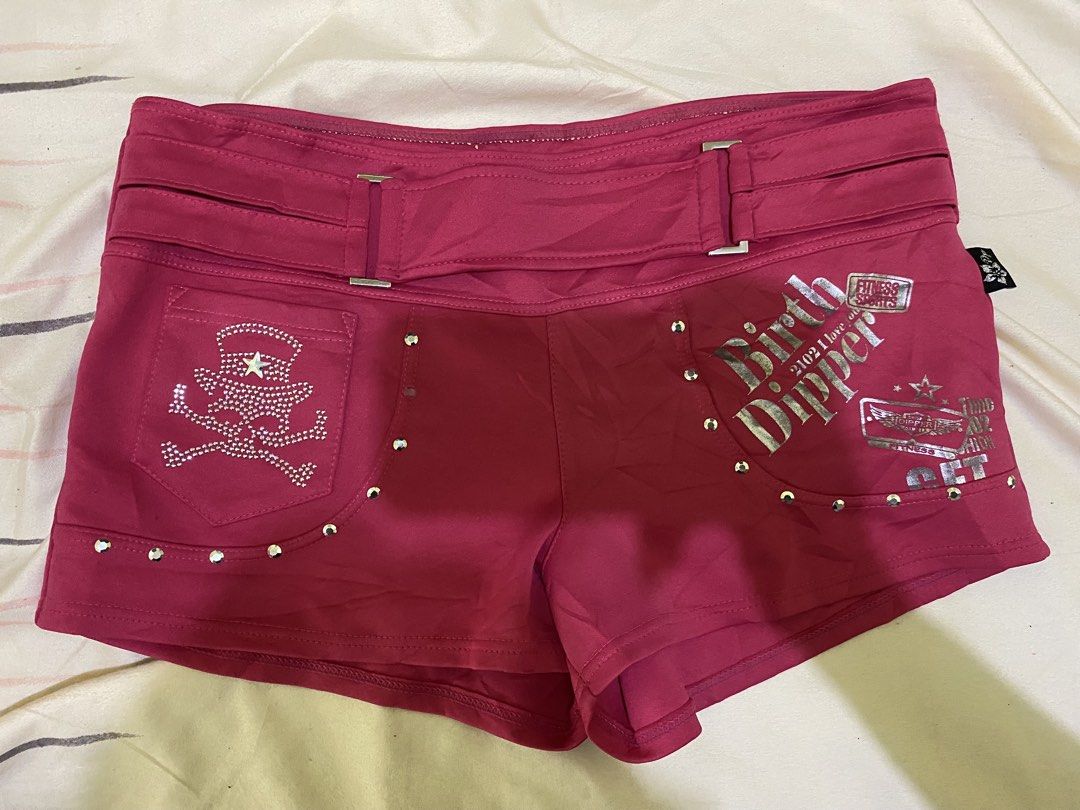 Dipper Pink Shorts with Rhinestones (Category: Shorts) located in Ozamiz City. Submitted by sw4gcvnt (Listing ID 1424458480, Image 1). Description: Stylish pink shorts from Dipper. Features rhinestone embellishments, including a skull design on the front pocket and "OK" on the back. Detailed with silver studs and decorative text. Includes a belt-like design at the waist. Perfect for a bold and unique look. SIZE 29-31.