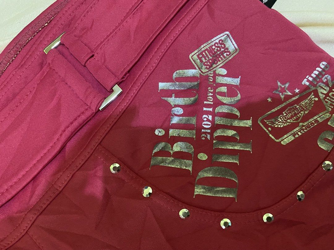 Dipper Pink Shorts with Rhinestones (Category: Shorts) located in Ozamiz City. Submitted by sw4gcvnt (Listing ID 1424458480, Image 3). Description: Stylish pink shorts from Dipper. Features rhinestone embellishments, including a skull design on the front pocket and "OK" on the back. Detailed with silver studs and decorative text. Includes a belt-like design at the waist. Perfect for a bold and unique look. SIZE 29-31.
