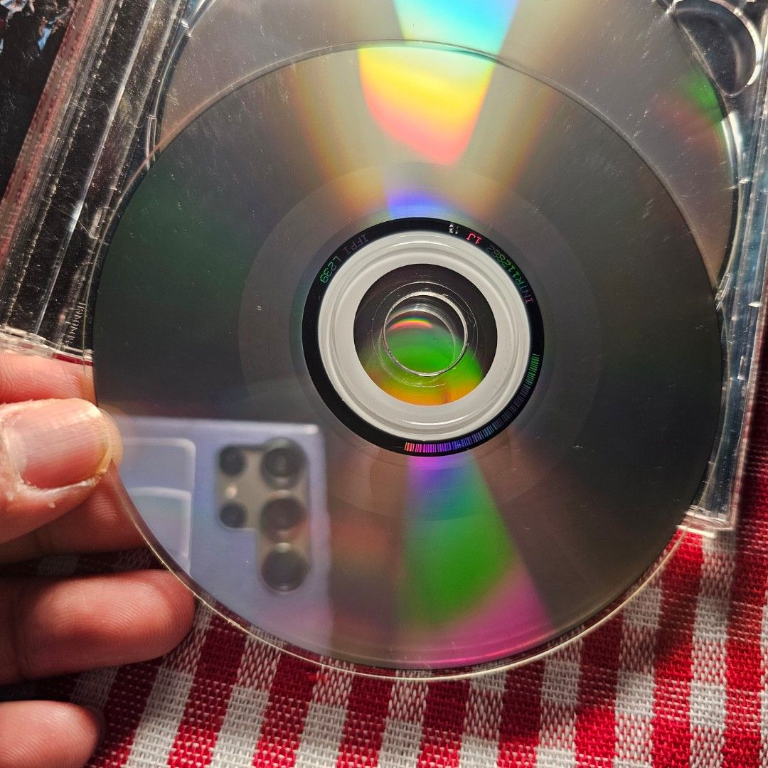 Eminem Encore CD - 2 CD- VG Condition (Category: CDs & DVDs) located in Quezon City. Submitted by serefrenpaz (Listing ID 1424500170, Image 3). Description: Eminem's Encore CD. Features the album's tracklist, including "Curtains Up", "Evil Deeds", and "Like Toy Soldiers". Includes a bonus CD with a handwritten message. The CD case shows some wear. The back of the case lists the tracks and credits Dr. Dre as executive producer..