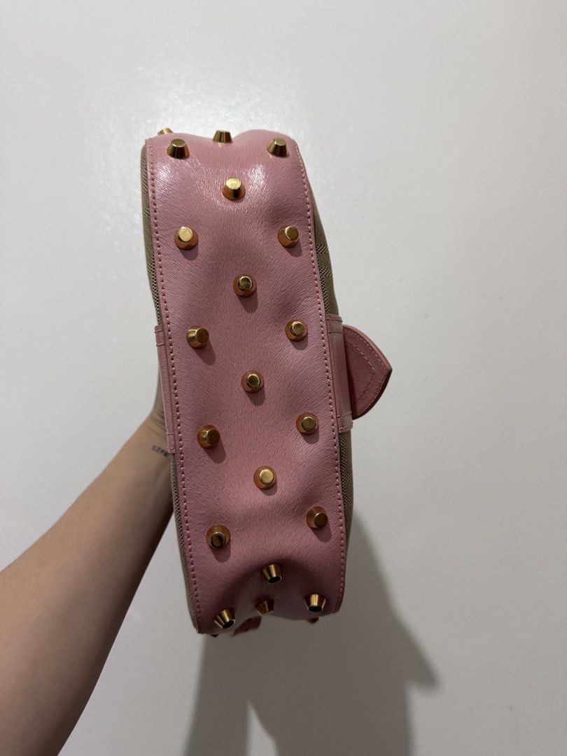 Fendi Shoulder Bag (Category: Luxury Bags & Wallets) located in Cainta. Submitted by bagsfromdara (Listing ID 1424406917, Image 3). Description: - Authentic Fendi shoulder bag - Pink leather flap - Gold-tone hardware - Canvas body with Fendi logo - Interior zip pocket - Some wear visible inside - Gold studs on the bottom.