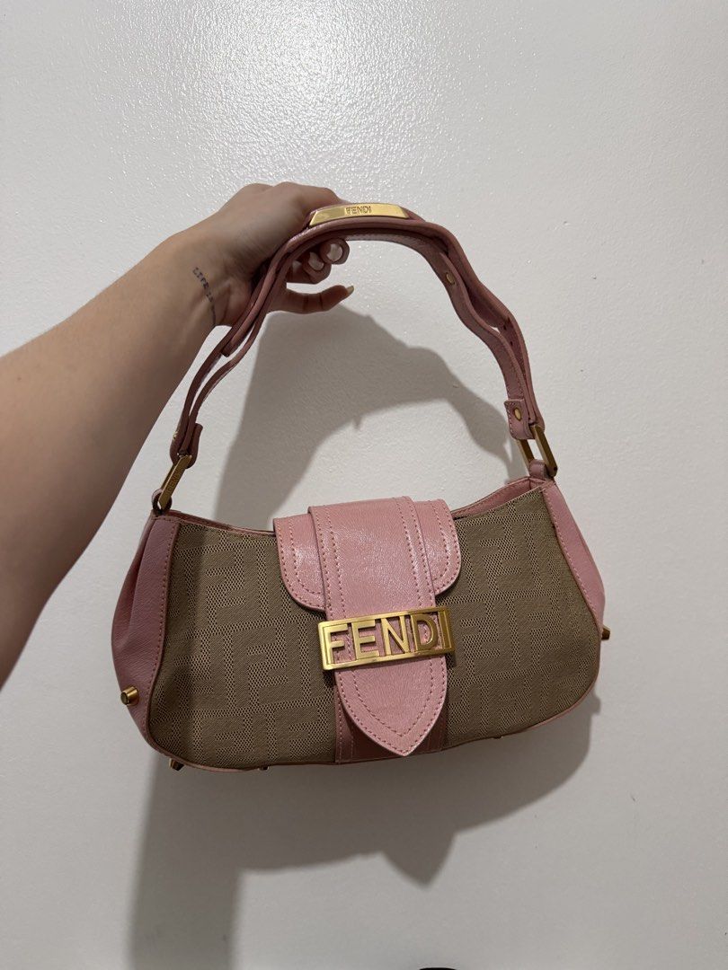 Fendi Shoulder Bag (Category: Luxury Bags & Wallets) located in Cainta. Submitted by bagsfromdara (Listing ID 1424406917, Image 1). Description: - Authentic Fendi shoulder bag - Pink leather flap - Gold-tone hardware - Canvas body with Fendi logo - Interior zip pocket - Some wear visible inside - Gold studs on the bottom.
