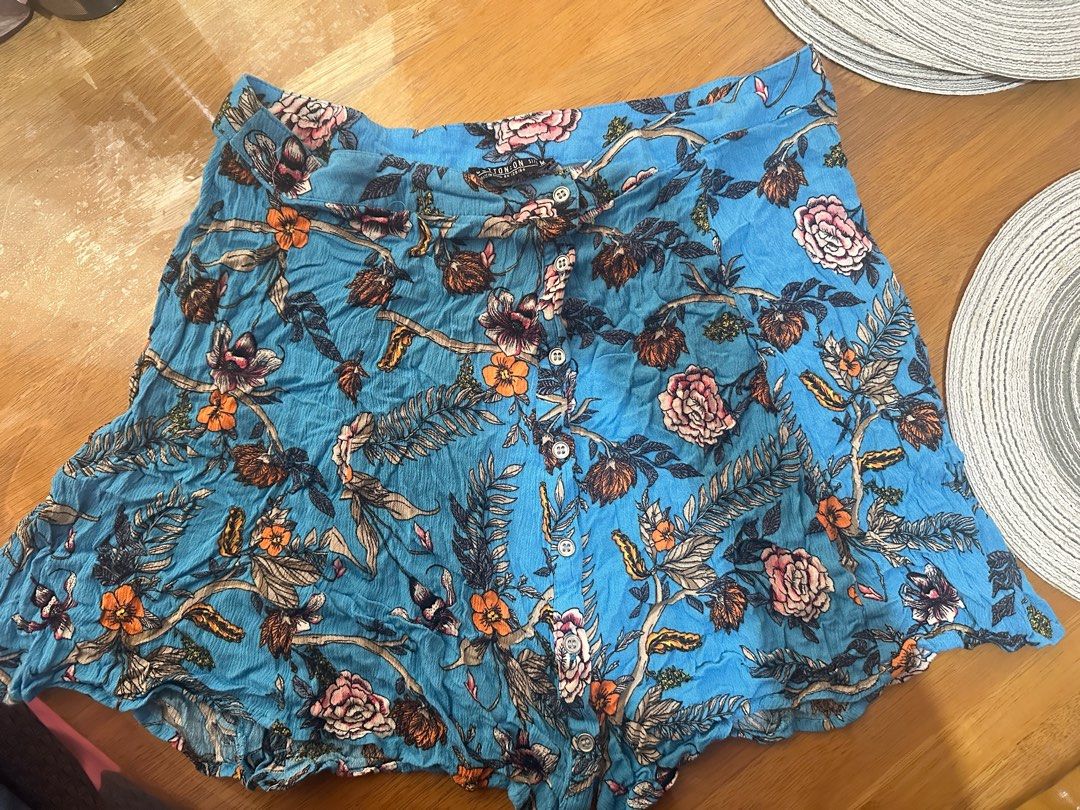 Floral Print Button-Up Skirt and Top Set (Category: Sets or Coordinates) located in Mandaluyong City. Submitted by pretty_karia (Listing ID 1424477002, Image 2). Description: - Floral print co-ord set - Colors: Blue, orange, and pink - Button-up skirt with flared silhouette - Button-up short-sleeved shirt - Lightweight fabric - Ideal for warm weather.