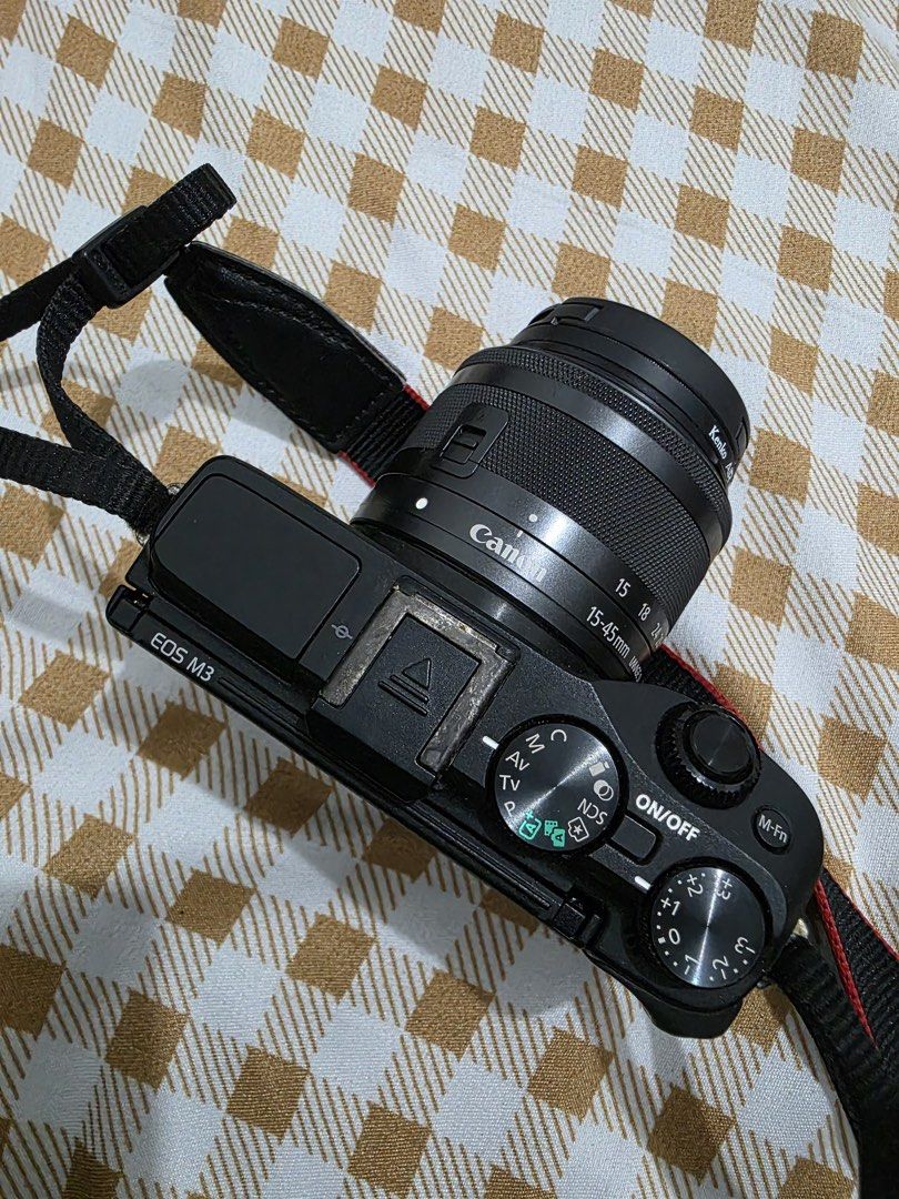 [UPDATED] For Sale: Canon EOS M3 (Used) (Category: Cameras) located in Manila. Submitted by loafmode_26 (Listing ID 1423945555, Image 3). Description: Selling my Canon EOS M3.It has some cosmetic wear from being used often. Condition: Lens & Screen: No issues. Lens is clear, and the screen works perfectly. Functionality: 100% working. Takes great pictures. Cosmetic Issue 1: The neck strap is stuck to the metal mount hole and cannot be removed (st