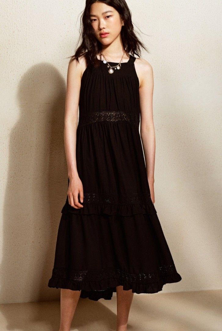 H&M Black Halter Dress (Category: Dresses) located in Quezon City. Submitted by miss.len (Listing ID 1424491567, Image 2). Description: - H&M black halter dress - Size: M - Features: - Tiered design - Lace detailing - Keyhole back - Midi length - Perfect for casual or dressy wear - Comfortable, lightweight fabric.
