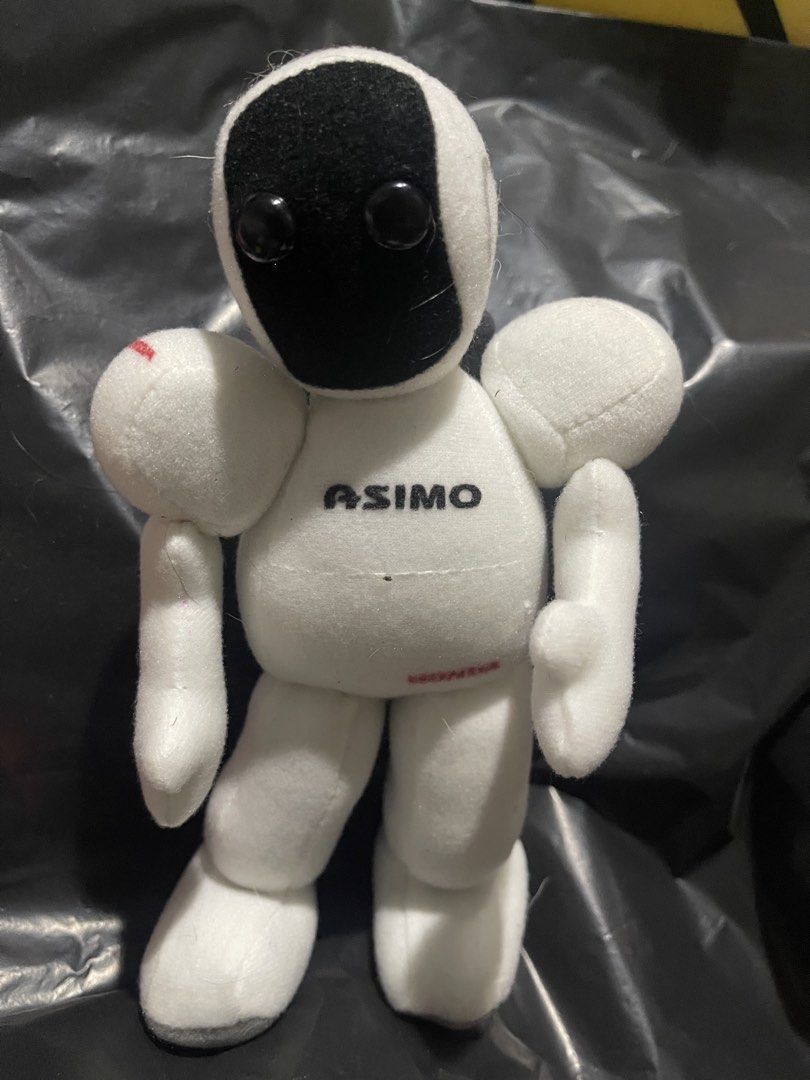 Honda ASIMO Plush Toy (Category: Plushies & Soft Toys) located in Muntinlupa City. Submitted by joanofarc1013 (Listing ID 1424421253, Image 1). Description: - Adorable Honda ASIMO plush toy! - Features the iconic ASIMO robot design. - Soft, cuddly, and perfect for snuggling. - White body with black accents. - Honda logo on the back, ASIMO logo on the front. - Great for collectors or kids!.