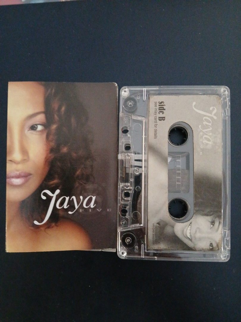 Jaya Cassette Tape (Category: CDs & DVDs) located in Pili. Submitted by marktoraldo (Listing ID 1424520272, Image 1). Description: add shippingfeeGcashpayment- Original Jaya cassette tape - Features Side A and Side B - Includes original case with song titles - Clear casing - Album cover features Jaya's image - Perfect for music collectors.