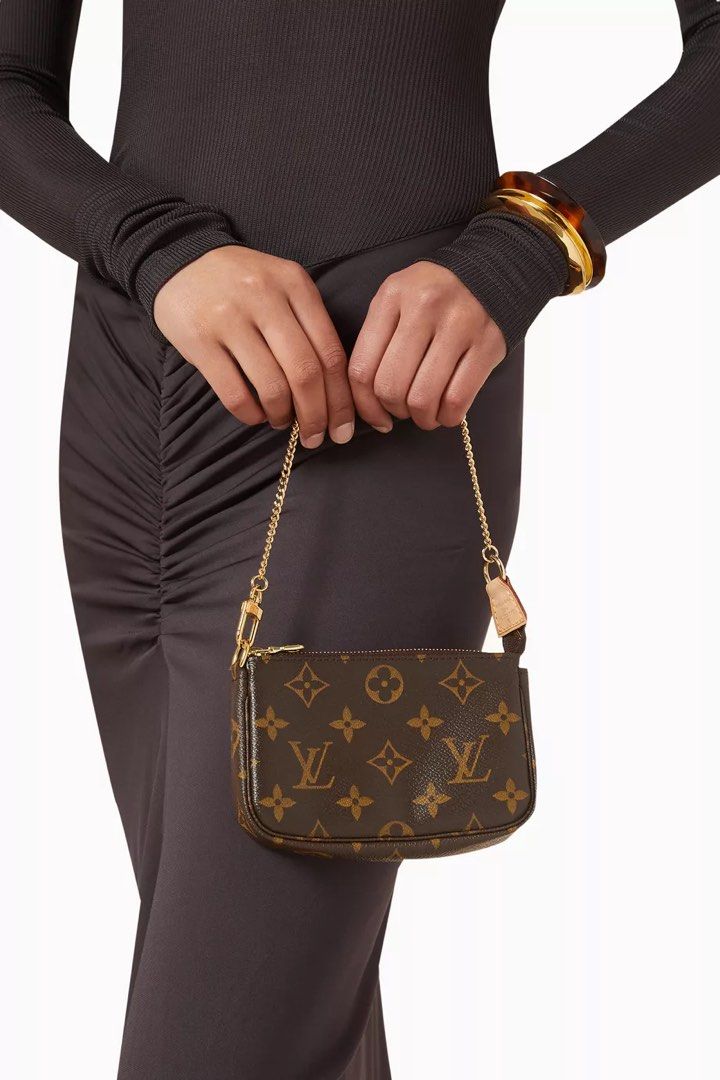 Louis Vuitton Mini Pochette (Category: Luxury Bags & Wallets) located in Davao. Submitted by _rjcn (Listing ID 1424458142, Image 3). Description: In excellent condition! Selling for a low price With box and accessories RFS: Extra bag.