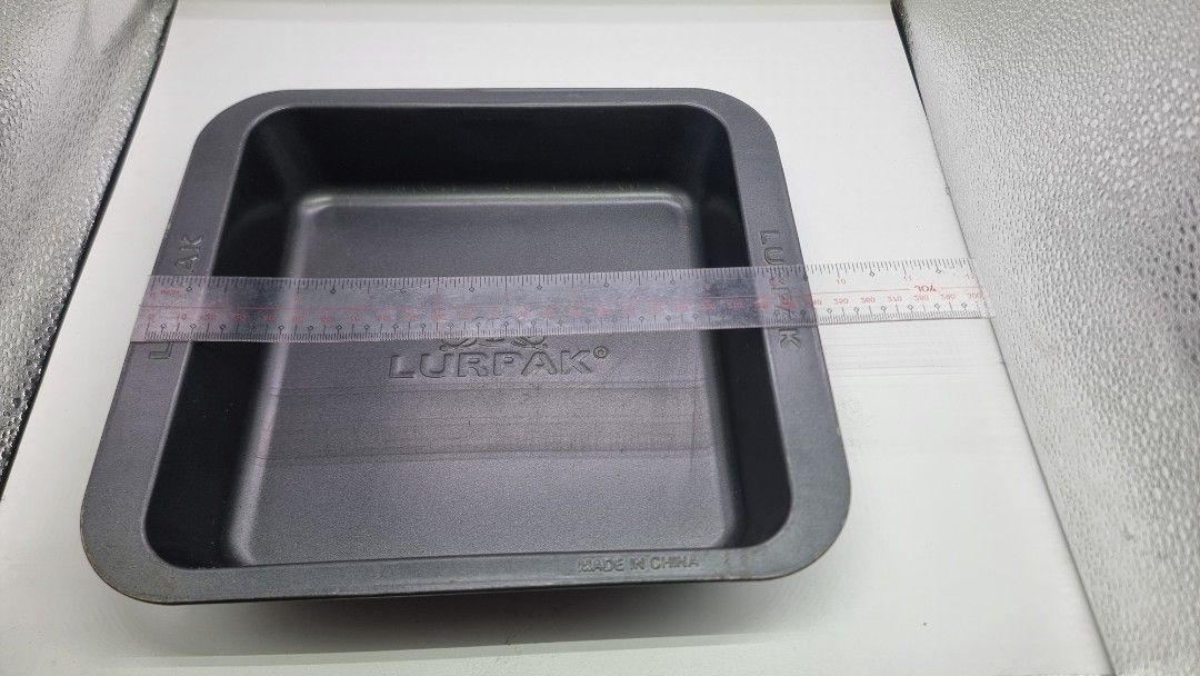 Lurpak Square Baking Pan (Category: Bakeware) located in Marikina City. Submitted by andreah_16 (Listing ID 1424356582, Image 2). Description: - Lurpak branded baking pan. - Size: Approximately 20cm x 20cm. - Material: Metal - Color: Dark gray - Shape: Square with rounded corners - Origin: Made in China.