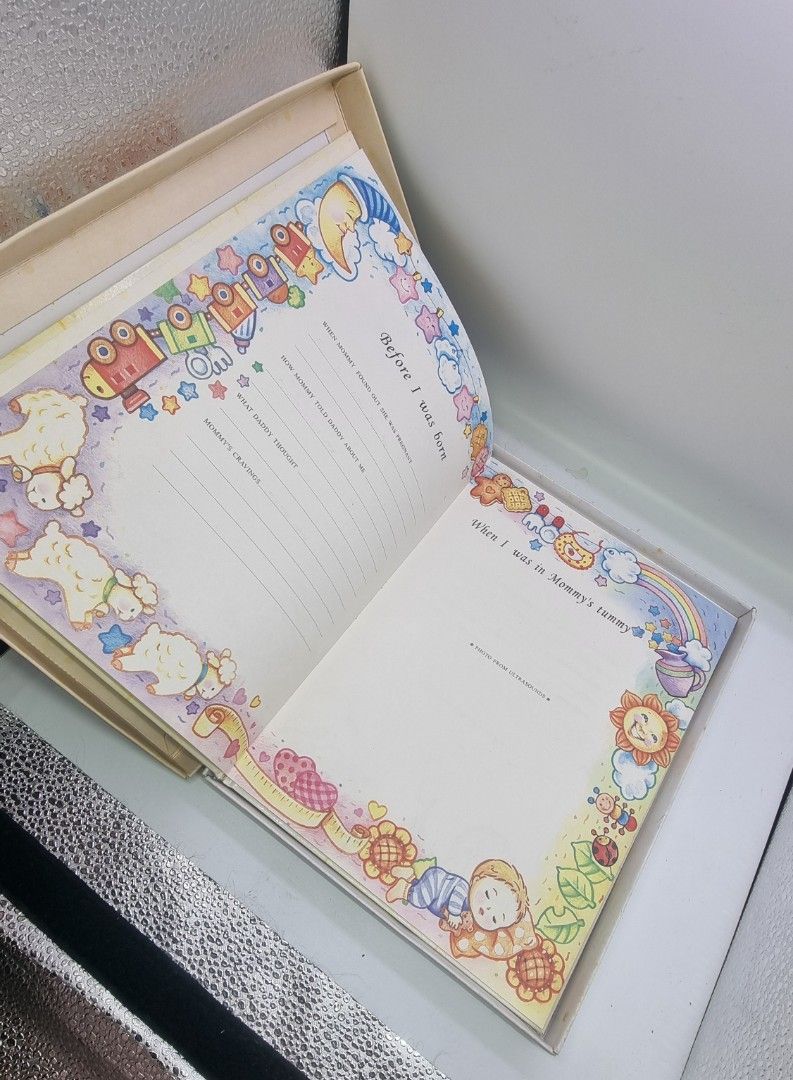 My 1st Scrapbook Baby Memory Book (Category: Art & Prints) located in Marikina City. Submitted by andreah_16 (Listing ID 1424374419, Image 3). Description: - Adorable baby memory scrapbook - Colorful illustrations - Pages to record baby's milestones (e.g., 'My name is', 'Before I was born', 'First meeting') - Includes a decorative storage box - Perfect for preserving precious memories.