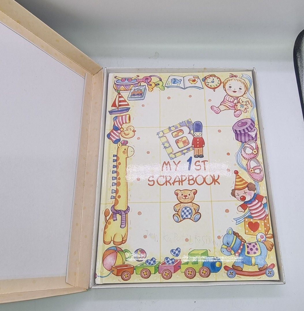 My 1st Scrapbook Baby Memory Book (Category: Art & Prints) located in Marikina City. Submitted by andreah_16 (Listing ID 1424374419, Image 1). Description: - Adorable baby memory scrapbook - Colorful illustrations - Pages to record baby's milestones (e.g., 'My name is', 'Before I was born', 'First meeting') - Includes a decorative storage box - Perfect for preserving precious memories.