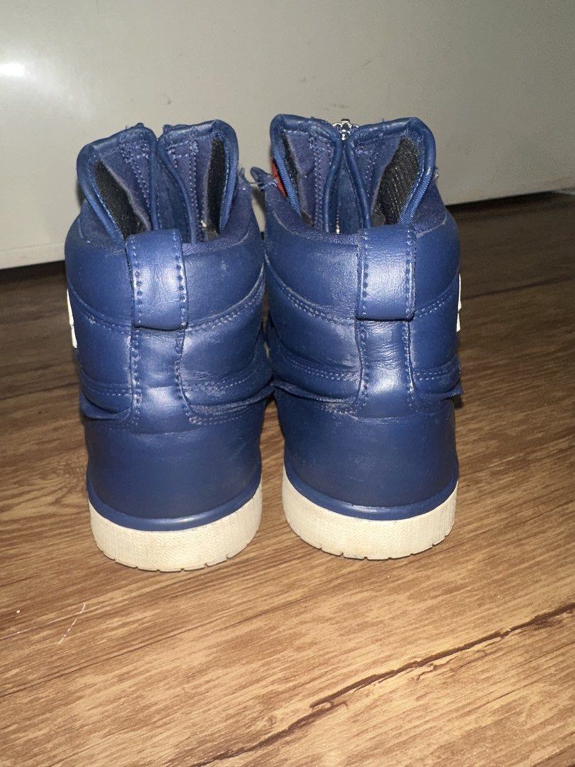 Nike Air Jordan 1 High Zip 'Navy' (Category: Sneakers) located in San Pablo. Submitted by crazyr17 (Listing ID 1424435605, Image 3). Description: Air Jordan 1 High Zip in navy blue. Features a zipper closure and the iconic Nike Air tag. The shoes have a white sole and the Air Jordan logo on the side. Size US 7, UK 4.5, EUR 38, CM 24. Model number AQ3742-401. Made in China. Repainted .